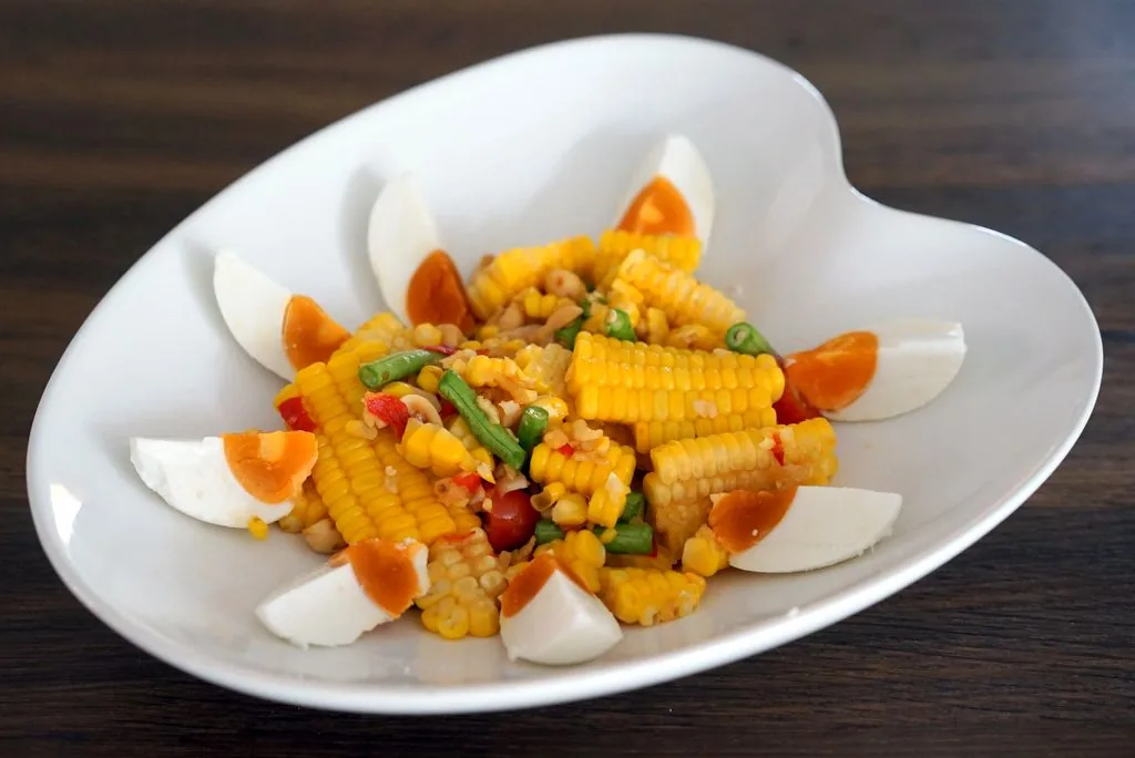 Tam Khao Phot, pounded corn salad with salted egg