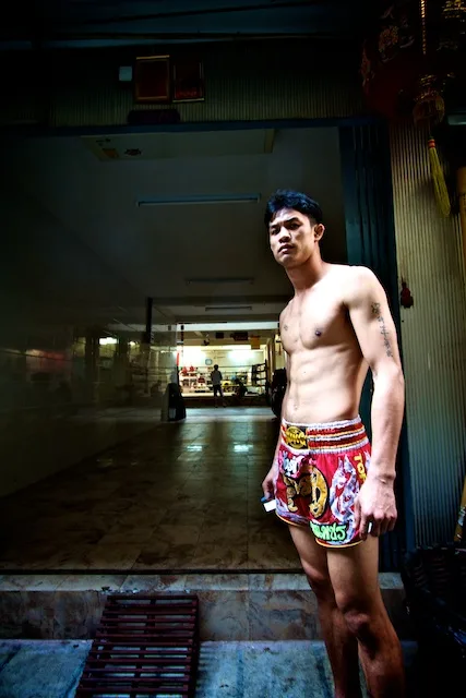A fighter at the entrance of Chuwattana Gym in Bangkok