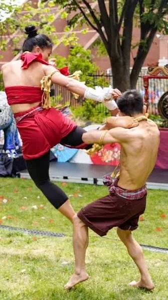 A high kick during a Muay Thai demonstration for Embassy Muay Thai