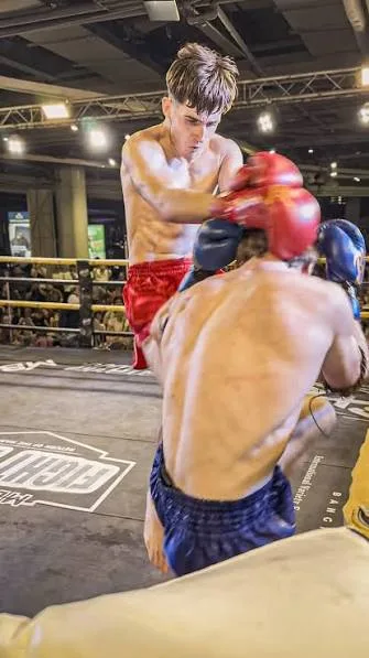 Fighters exchanging punches in the ring at Sasiprapa Gym
