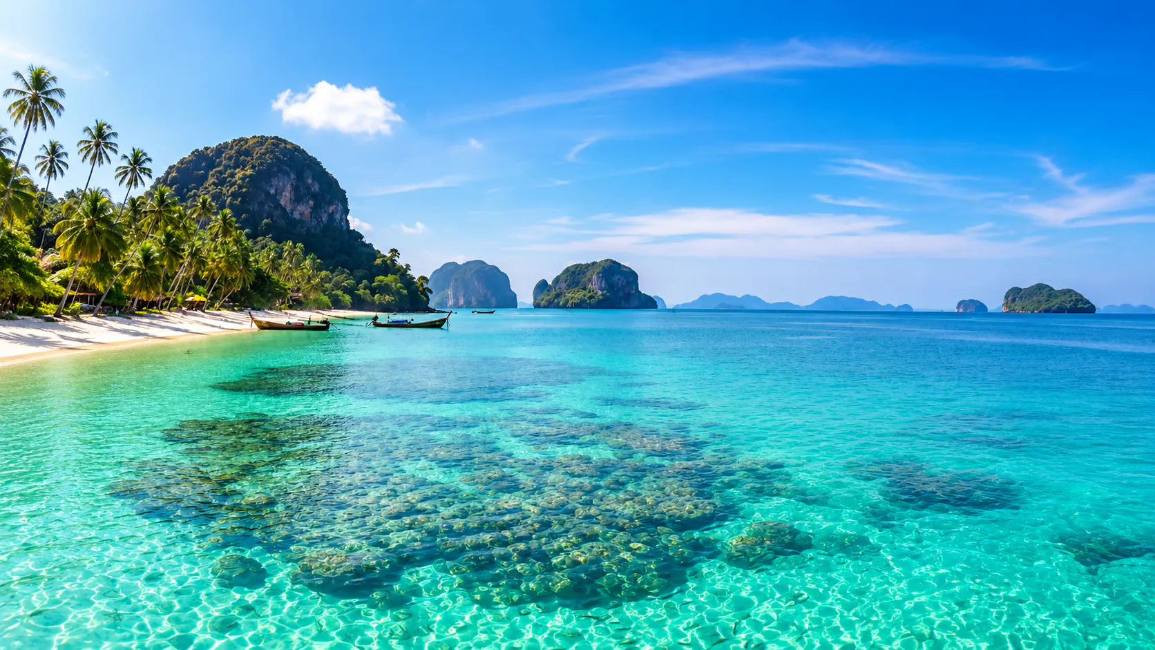 Andaman west coast: limestone islands, longtail boats, and clear shallow water