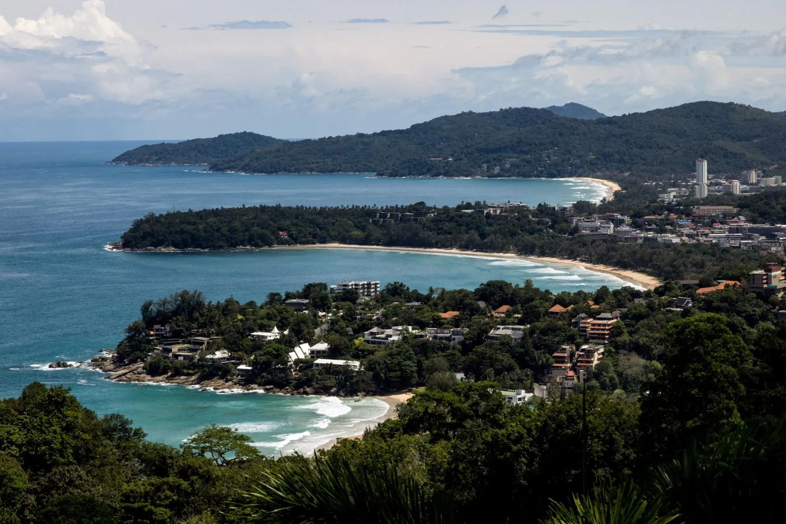 Panoramic view of three crescent bays along the Phuket coastline